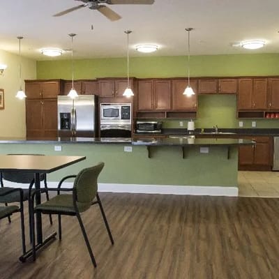 Bright interior of a kitchen area with dining table.