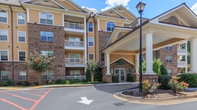 Exterior view of Galleria Manor with entrance and landscaping