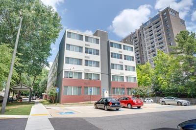 Exterior view of Lenox Summit Apartments with parking
