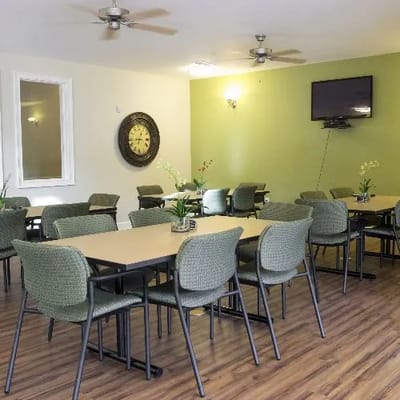 Bright dining room with tables and chairs