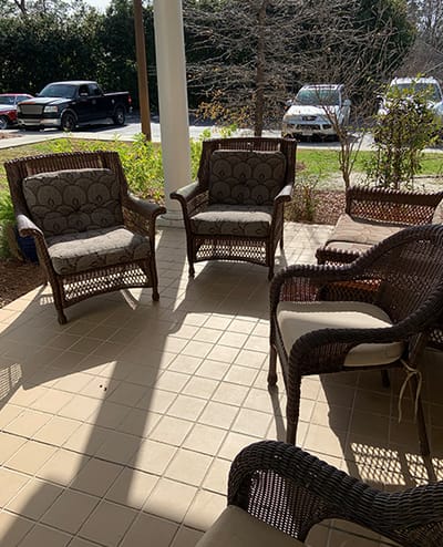 Outdoor seating area with wicker chairs on a patio