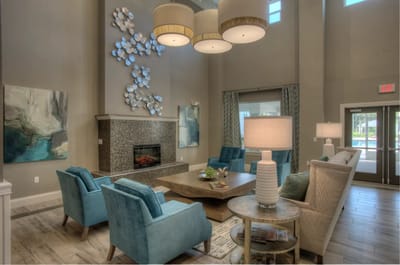 Bright common area with comfortable seating and decor