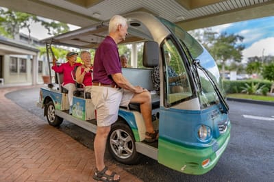 Residents enjoying a ride in a facility transport vehicle