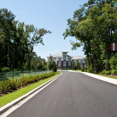 View of the facility building from a landscaped entrance