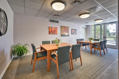 Bright common area with tables and chairs