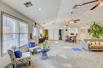 Bright common area with seating and natural light
