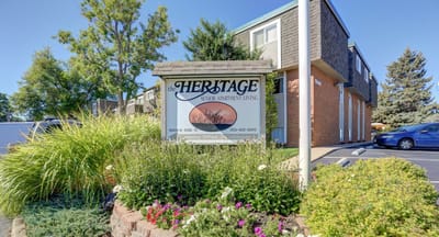Exterior view of The Heritage senior living facility sign