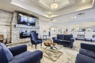 Cozy lounge area with blue seating and modern decor