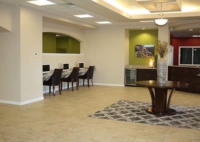 Interior view of a modern common area with computers