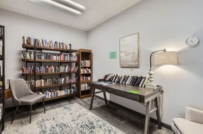 Cozy reading nook with bookshelves and a desk