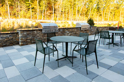 Outdoor dining area with grills and seating