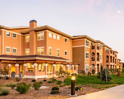 Mirasol Senior Community, nursing home in Loveland, CO — Exterior view of a senior living facility at dusk