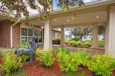 Garden area with decorative statue and greenery