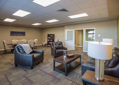 Bright common area with seating and tables