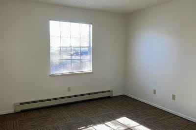 Empty interior room with window and flooring