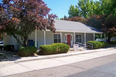Exterior view of Nellie Bechtel Apartments with landscaped area