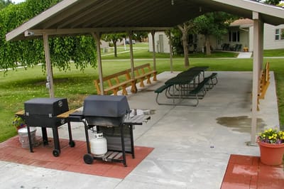 Outdoor covered seating area with grills