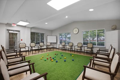 Activity room with seating and bocce balls on the floor