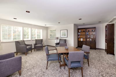 Bright common area with seating and bookshelves