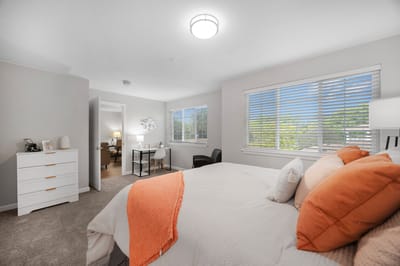 Bright, well-furnished resident room with windows