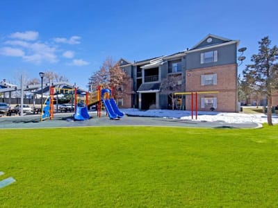 Exterior view of a nursing home with playground equipment