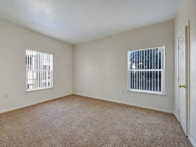 Empty interior room with two windows