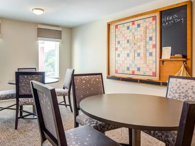Common area with a Scrabble board and seating
