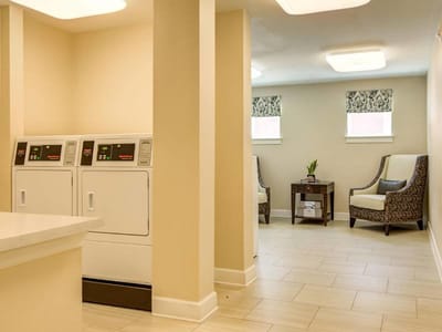 Interior area with laundry machines and seating
