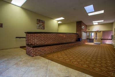 Interior view of a common area with a reception desk