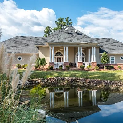 Exterior view of the Potemkin Senior Village with a pond