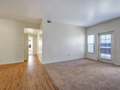 Bright, empty living room space in an apartment