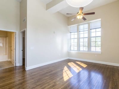 Bright, empty interior room with large windows