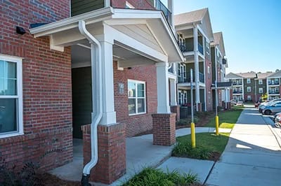 Entrance of a senior living facility with covered porch