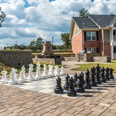 Large outdoor chess set near the building