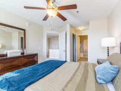 A well-furnished private resident room with a bed and decor