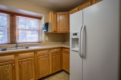 Cozy kitchen area with wooden cabinets