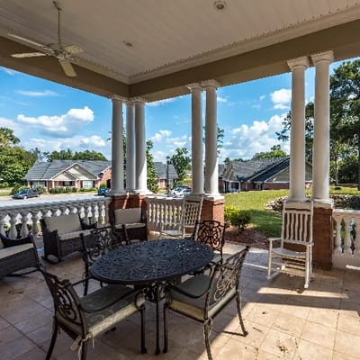 Outdoor seating area on a covered porch