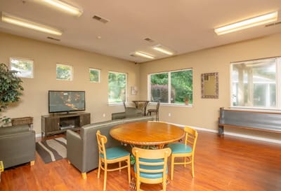 Interior view of a common area with seating and a table