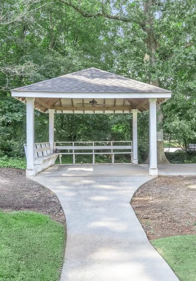 A gazebo in a landscaped outdoor space