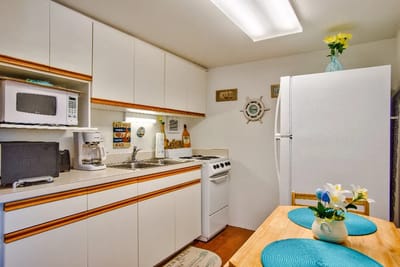 Bright kitchen area with a dining table and appliances
