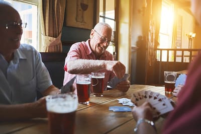 Residents playing cards in a common area