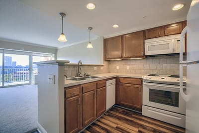 Bright kitchen with modern appliances and balcony view