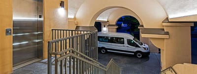 Elevator lobby with facility transport van visible