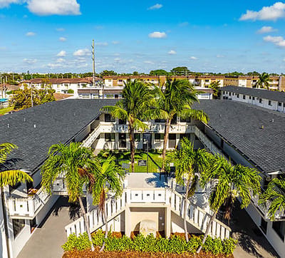 Aerial view of a courtyard with palm trees
