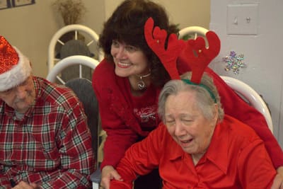 Residents celebrating with holiday attire and decorations