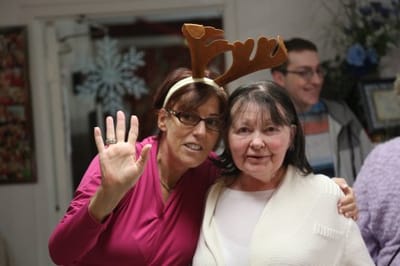 Residents celebrating with festive attire at an indoor event