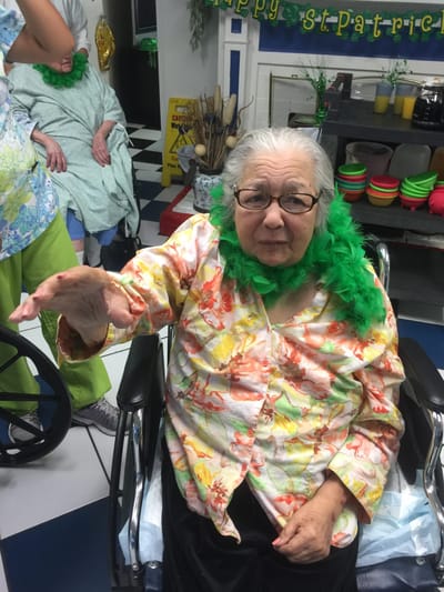 Residents enjoying a festive St. Patrick's Day celebration indoors