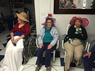 Residents wearing hats in a common area