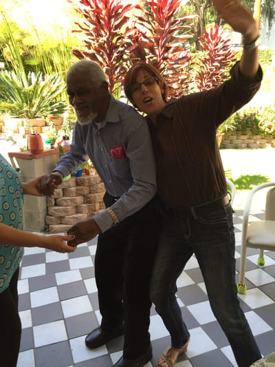 Residents enjoying a fun dance activity outdoors