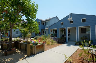 Outdoor view of the facility's building and garden area.